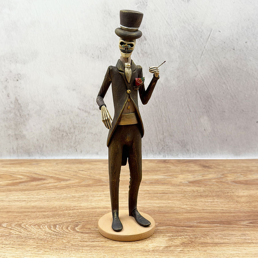 Catrín in a brown and gold suit