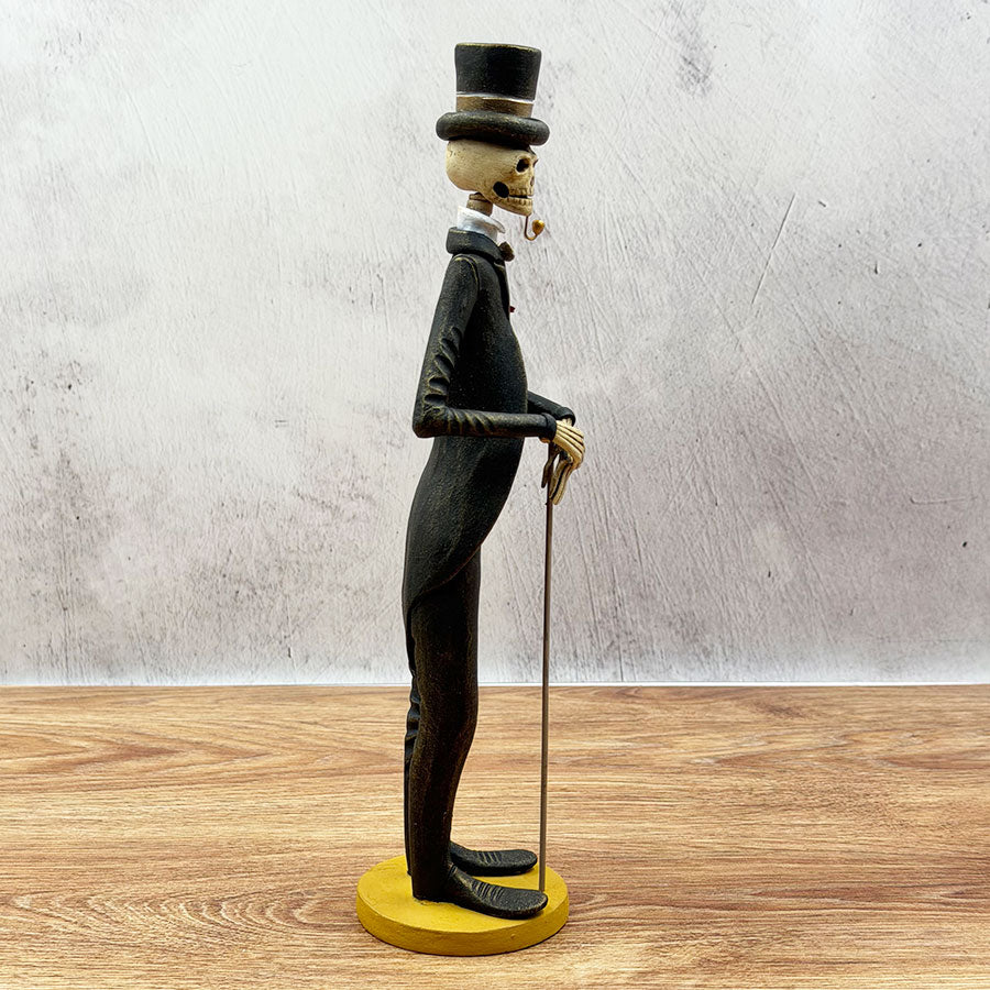 atrín with a brown and gold suit and a rose 