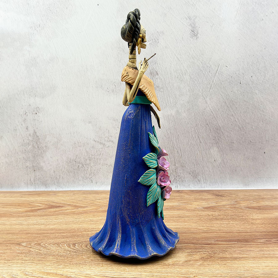 Catrina in a blue dress and pink flowers