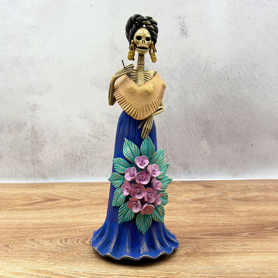 Catrina in a blue dress and pink flowers