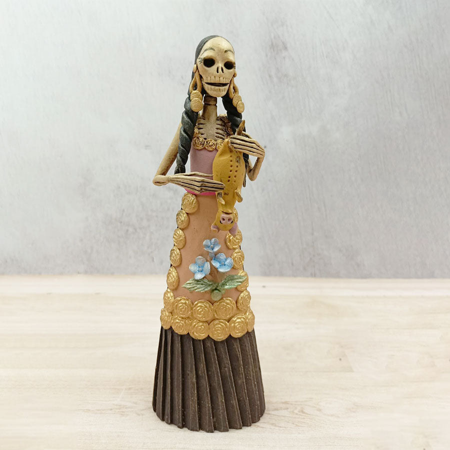 Catrina with a brown pig