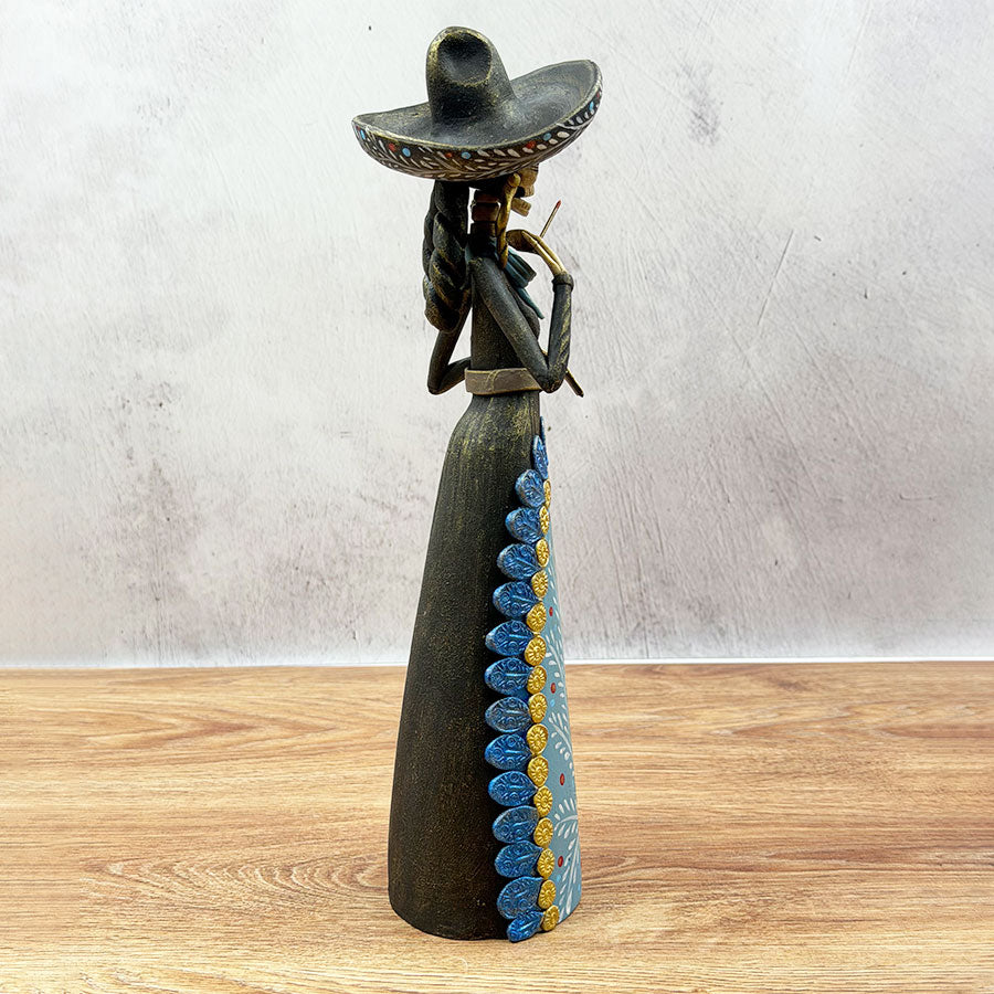 Catrina wearing a black and blue charra work outfit