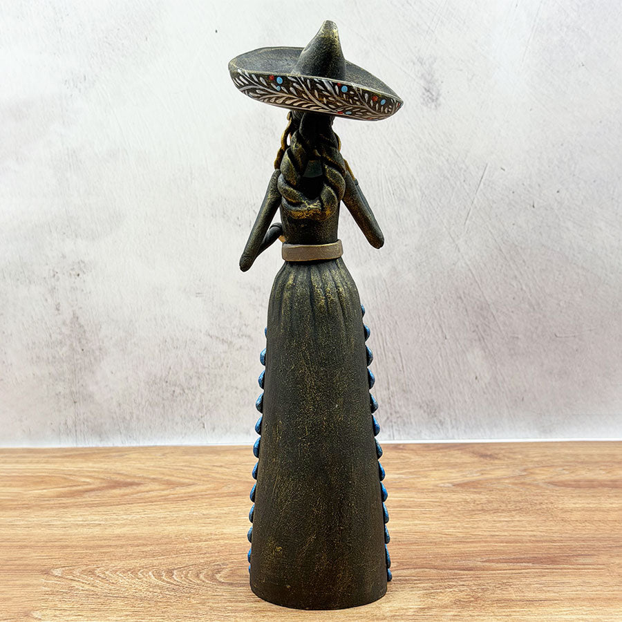 Catrina wearing a black and blue charra work outfit