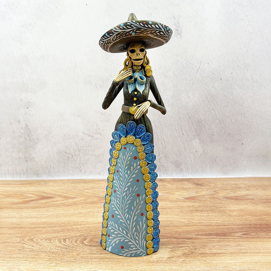 Catrina wearing a black and blue charra work outfit