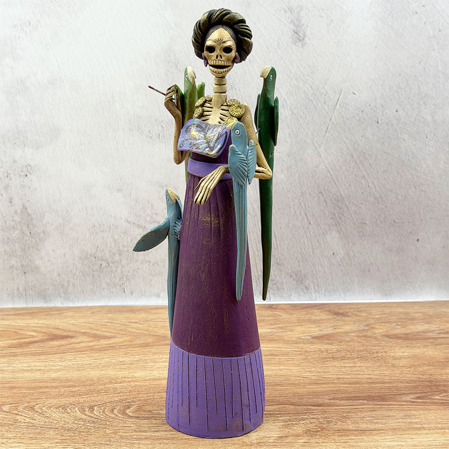 Catrina with purple dress and birds