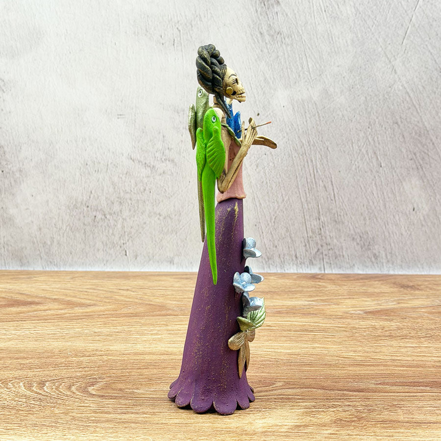 Catrina with a purple dress and macaws