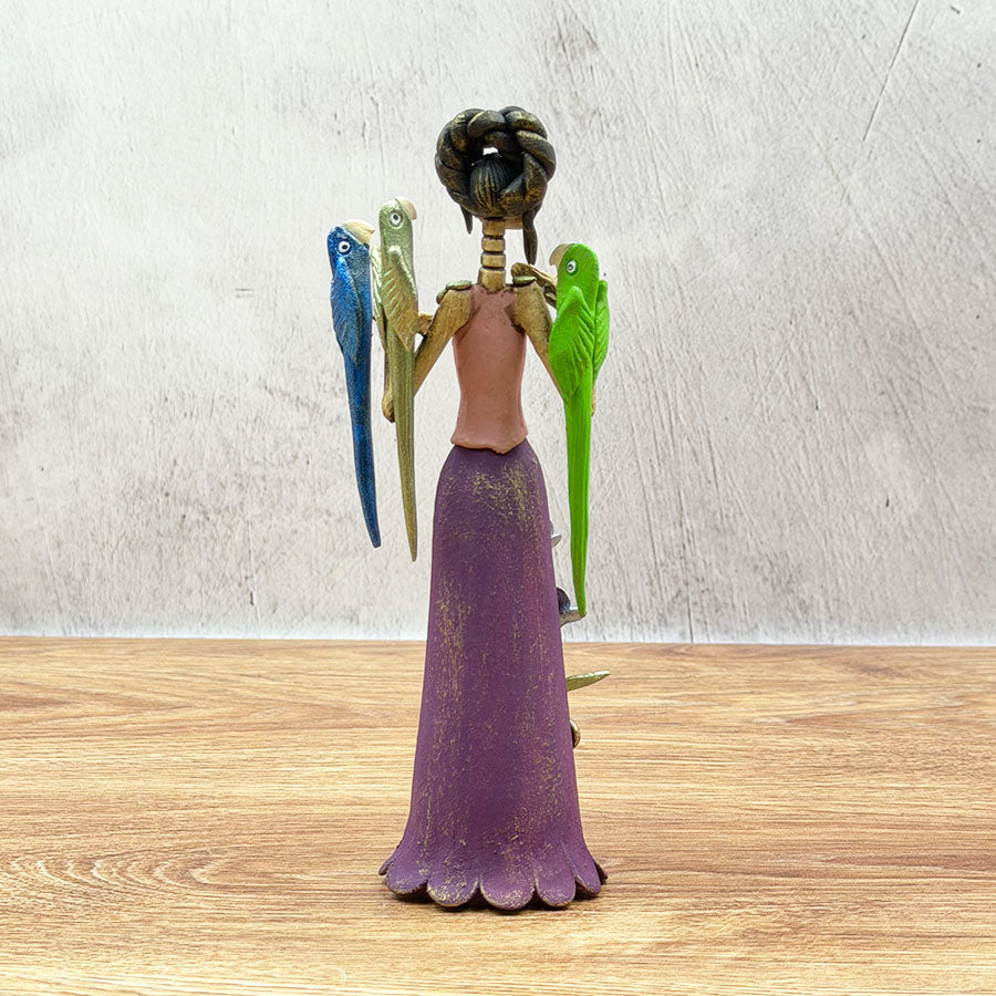 Catrina with a purple dress and macaws