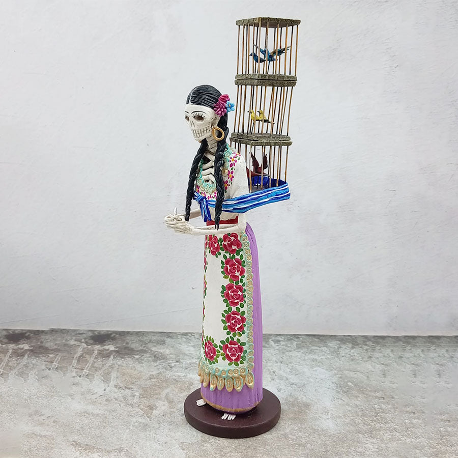 Catrina morada vendedora de pájaros