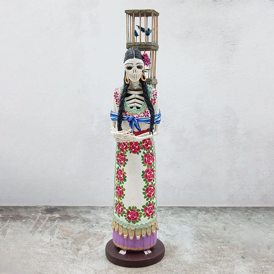 Catrina morada vendedora de pájaros