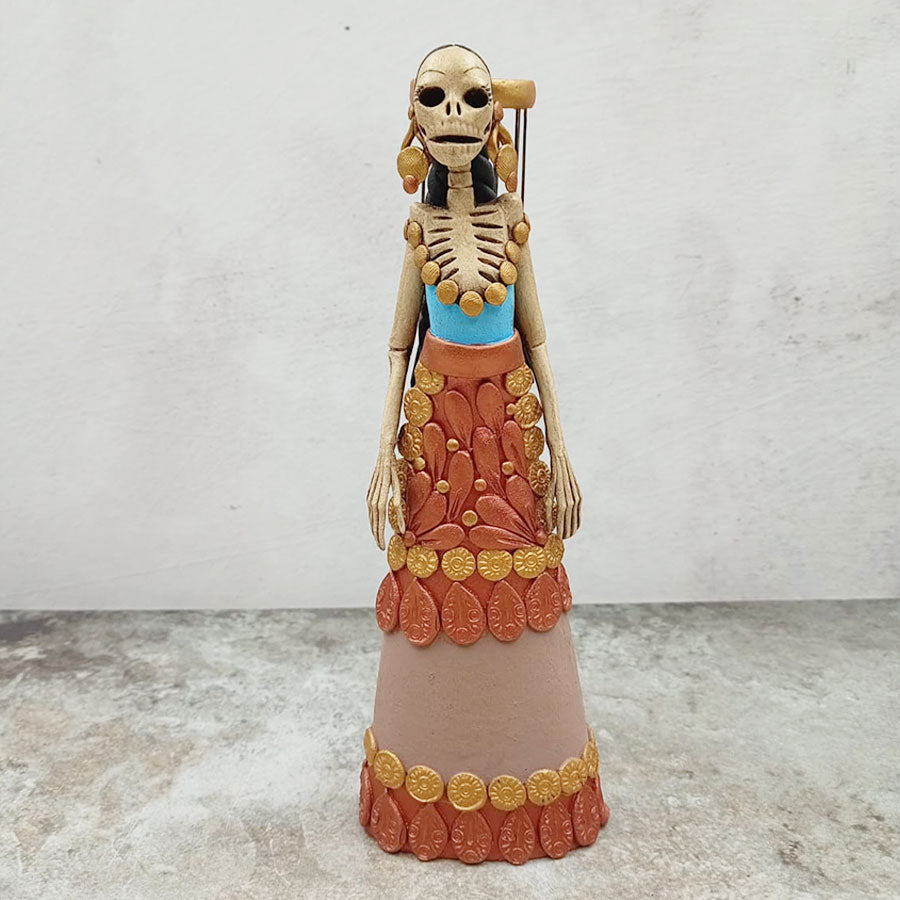 Catrina con jaula y pajarito rojo