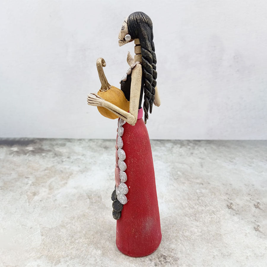 Catrina con falda roja y calabaza café
