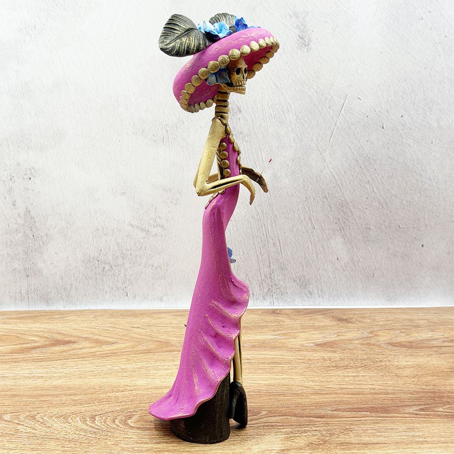 Catrina with a pink dress and hat