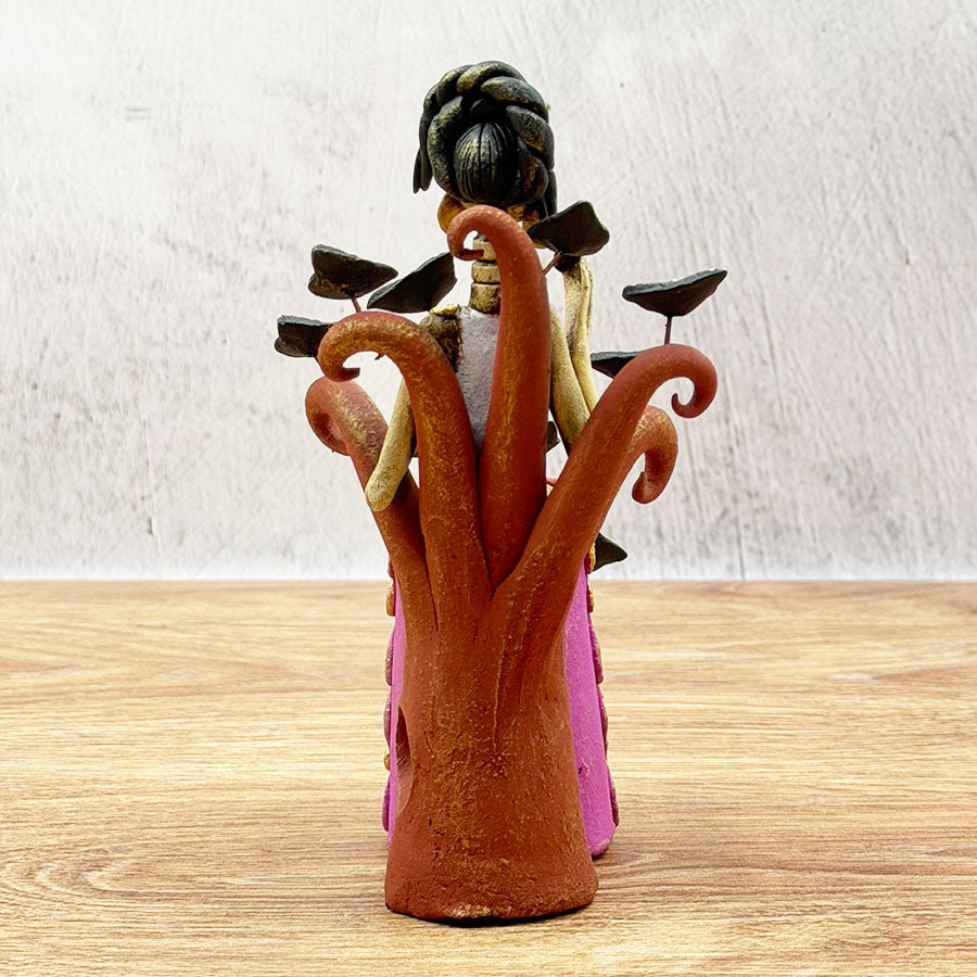 Pink Catrina seated with butterflies