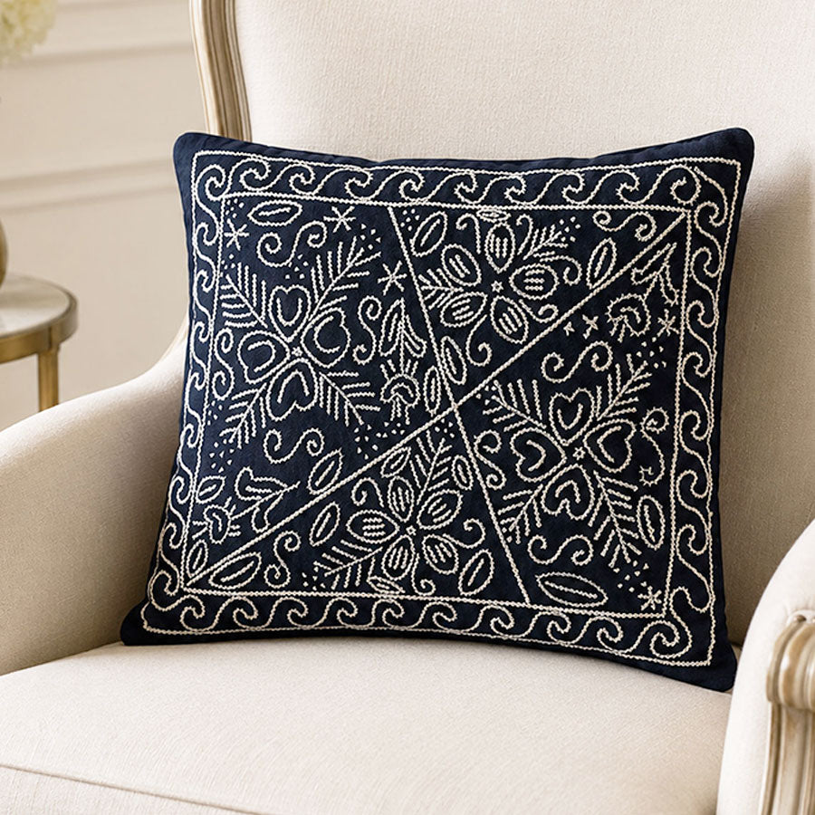 Black cushion cover with embroidered white flowers
