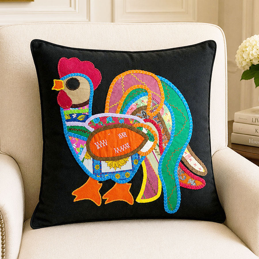 Black cushion cover with colorful rooster
