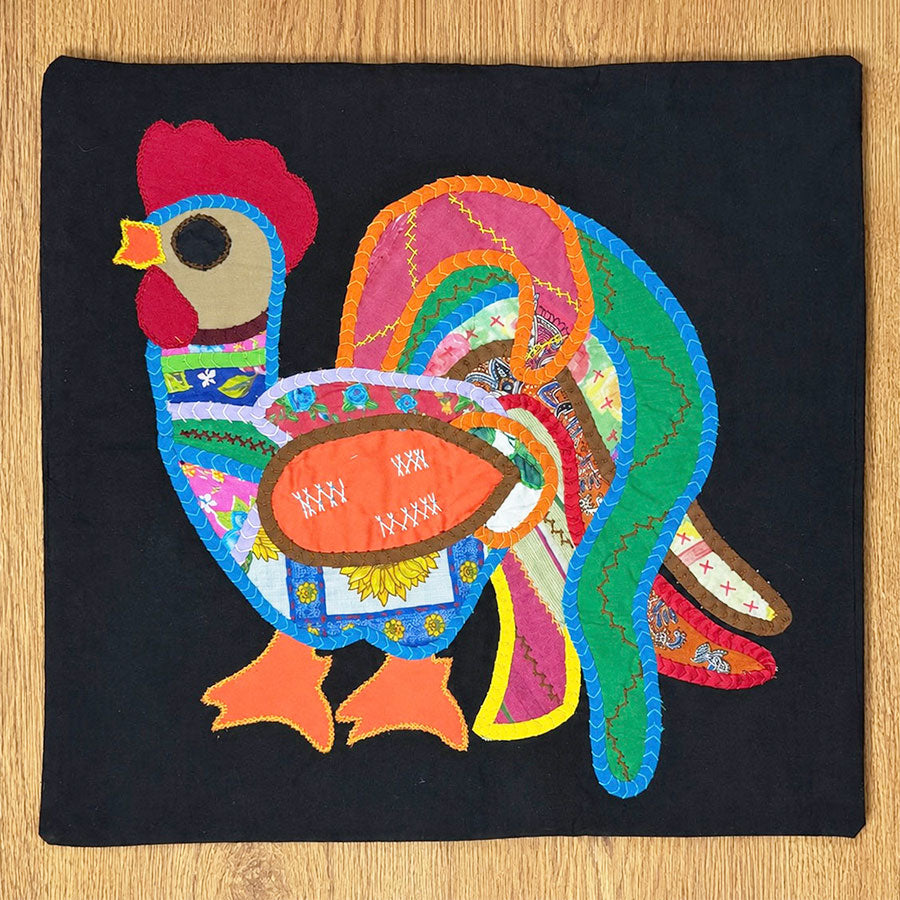 Black cushion cover with colorful rooster
