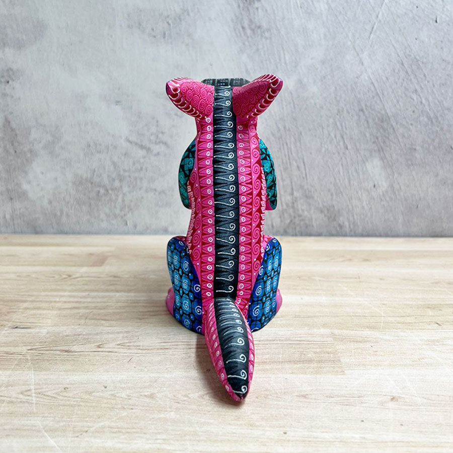 Pink alebrije rabbit with saxophone