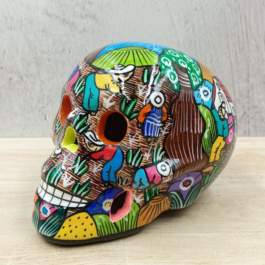 Cráneo con escenas de campo mediano