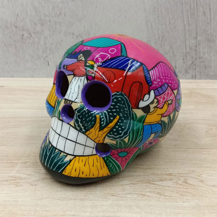 Small skull with country scenes