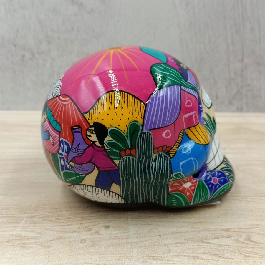 Small skull with country scenes