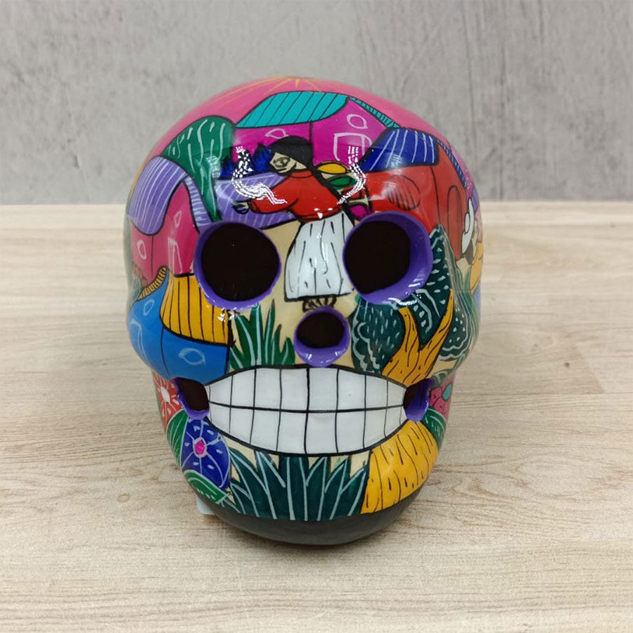 Small skull with country scenes