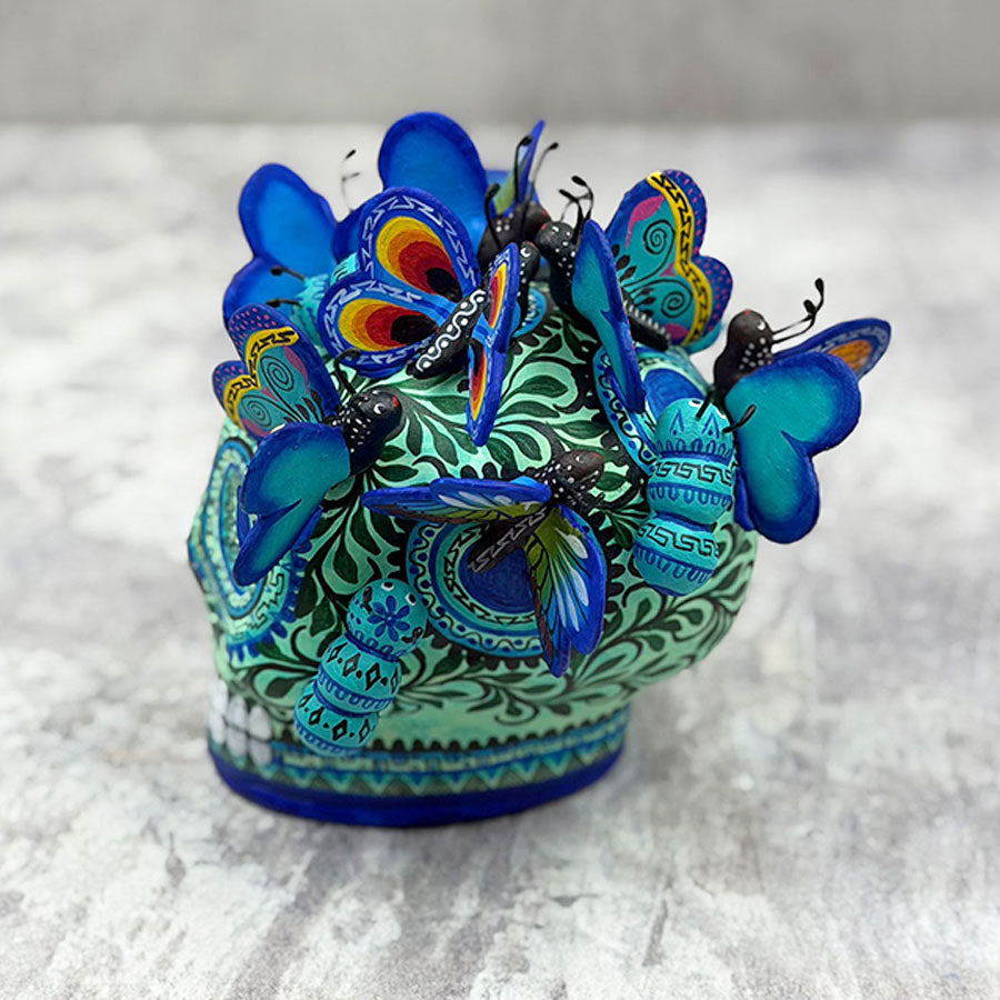 Blue skull with butterflies