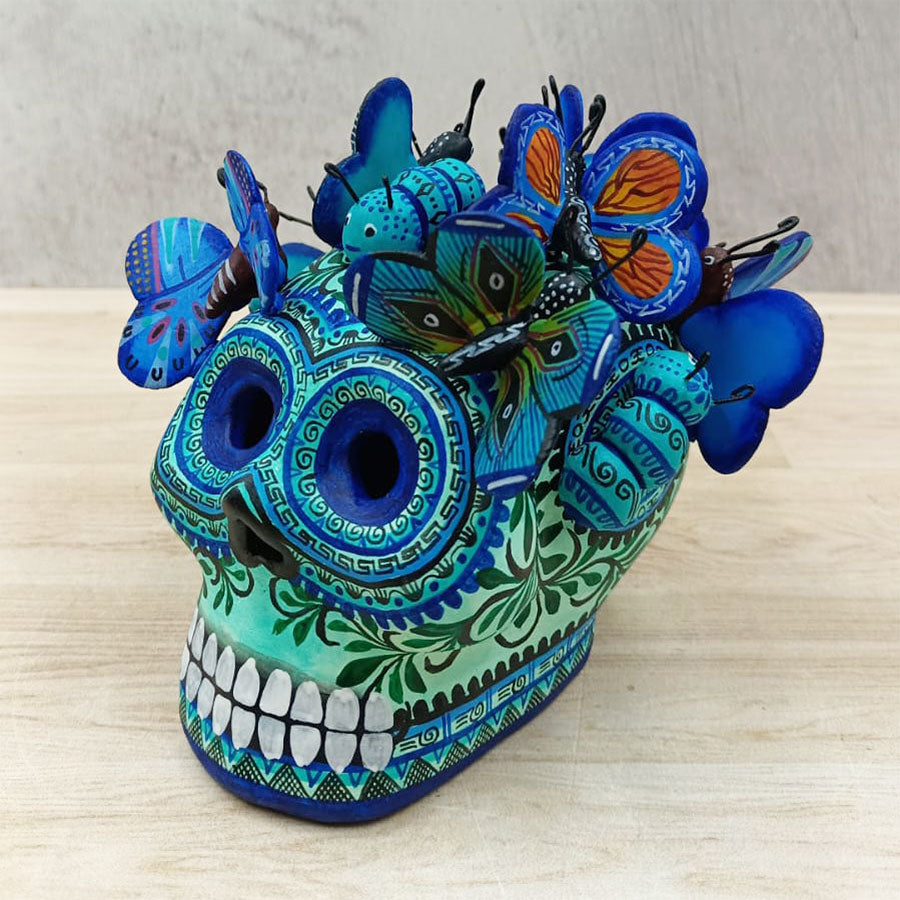 Blue skull with butterflies