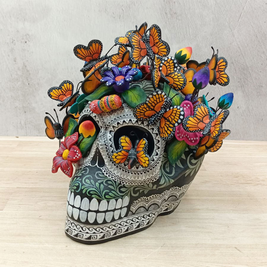 Skull with butterflies and colorful flowers