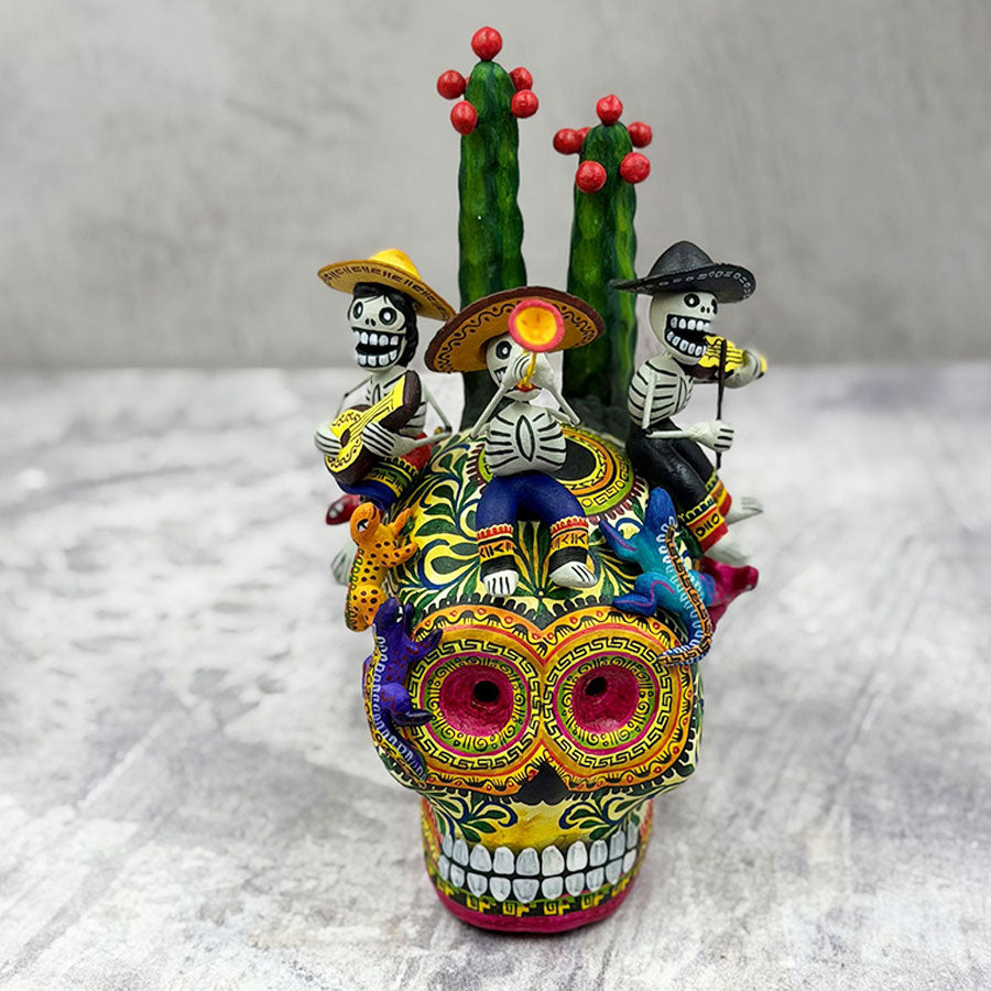 Skull decorated with little skull musicians