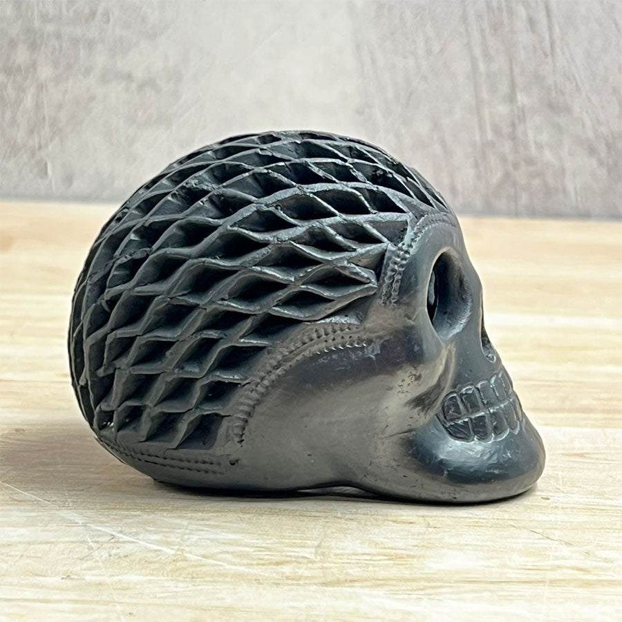 Mini openwork skull made of black clay