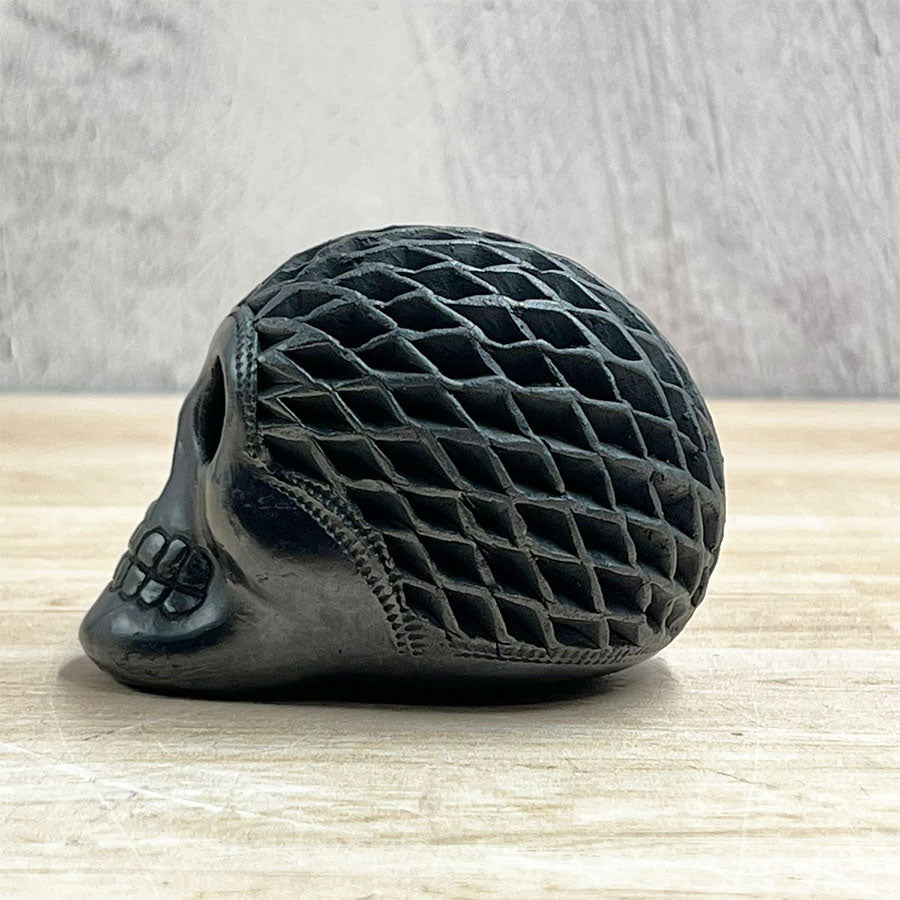 Mini openwork skull made of black clay