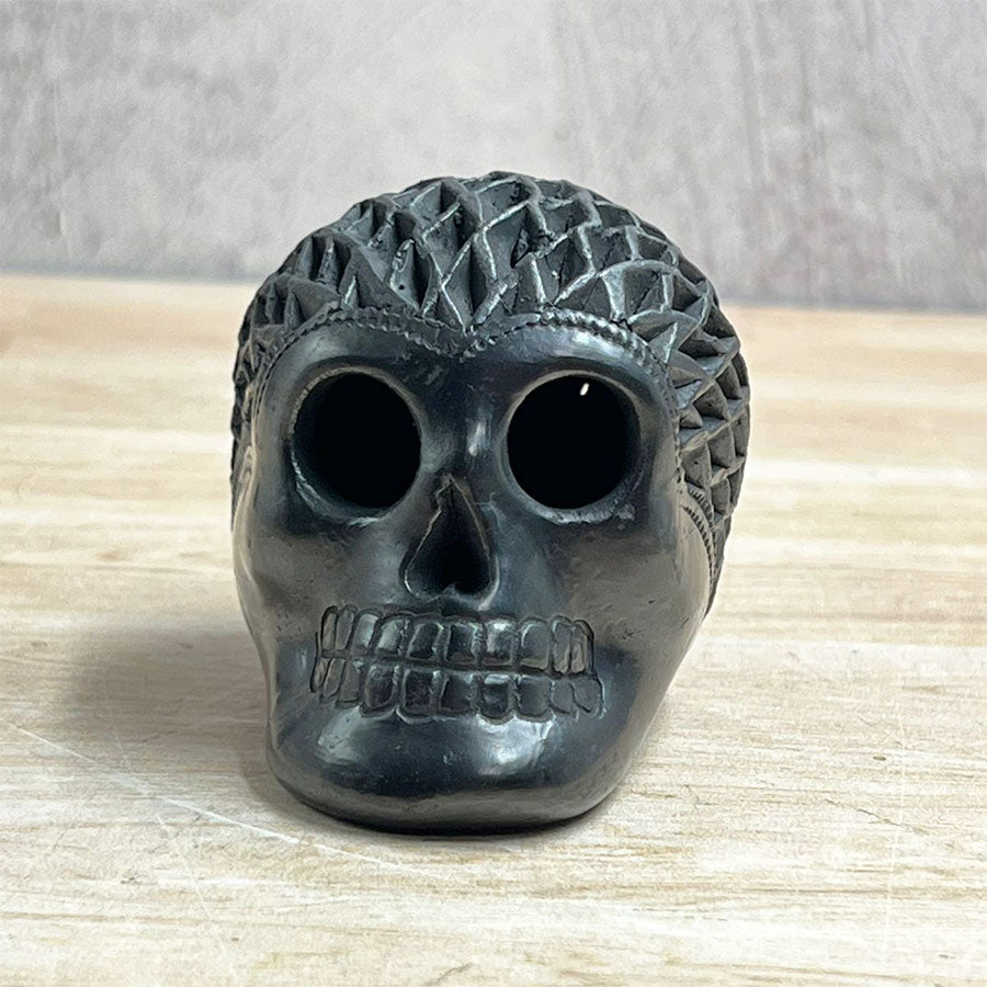 Mini openwork skull made of black clay