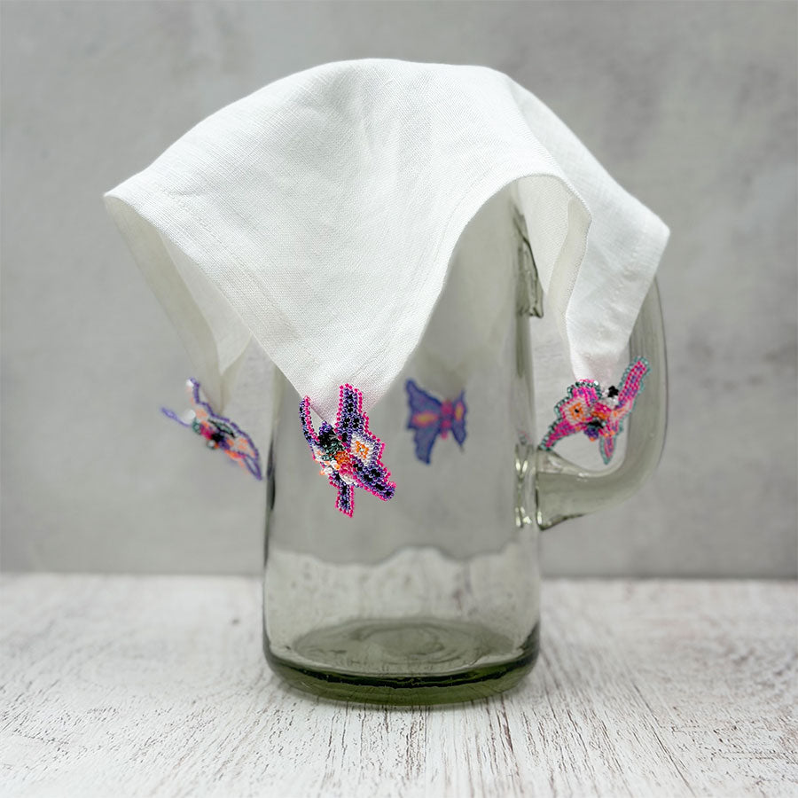 Cover pitcher with beaded figures