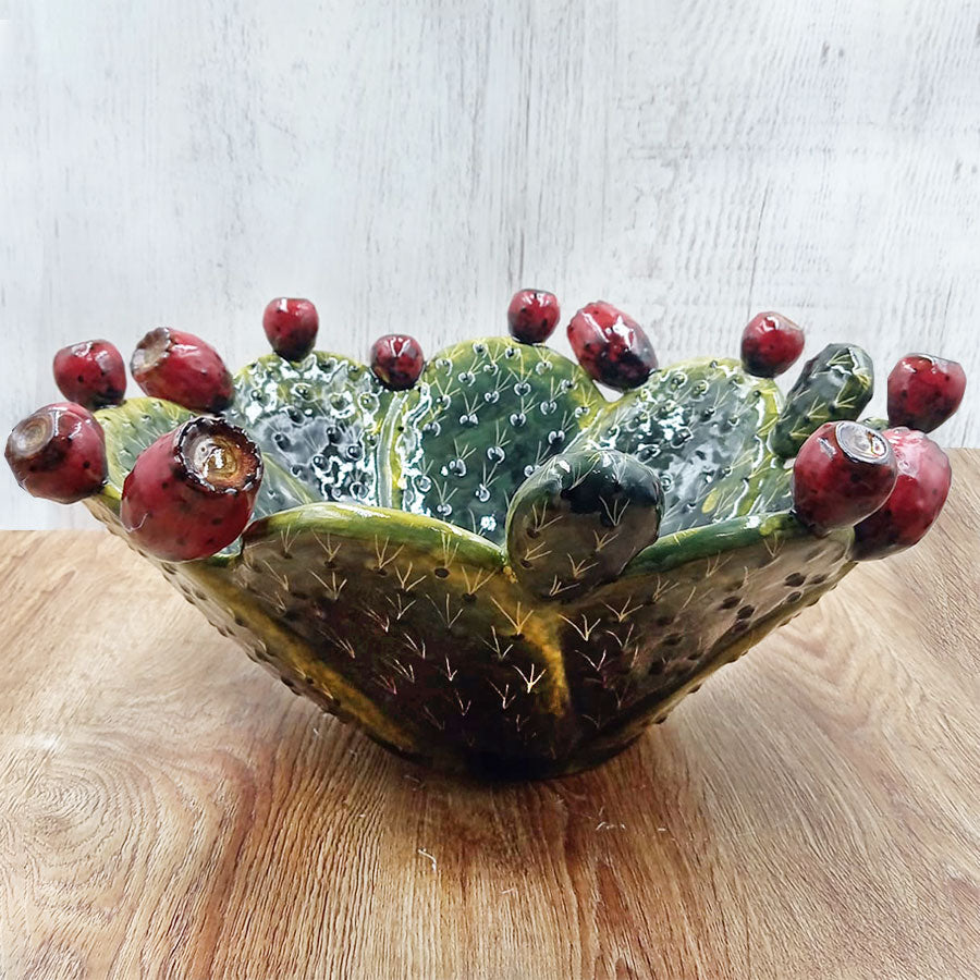 Salad bowl featuring a design of prickly pear pads and fruit.