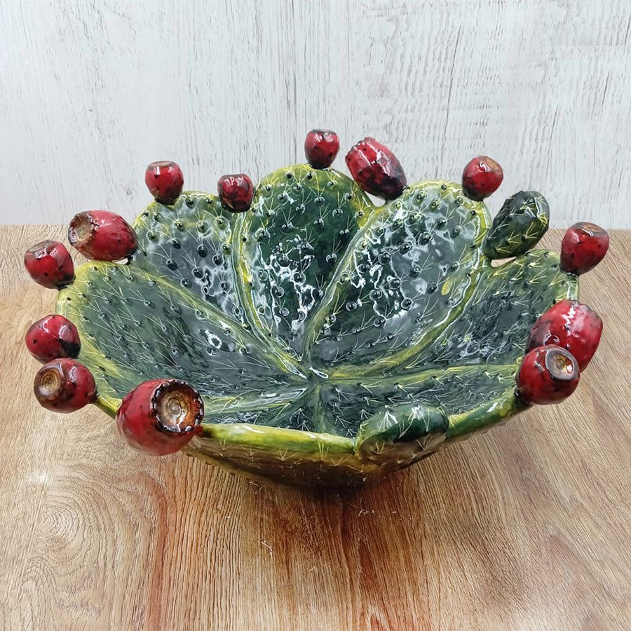 Salad bowl featuring a design of prickly pear pads and fruit.