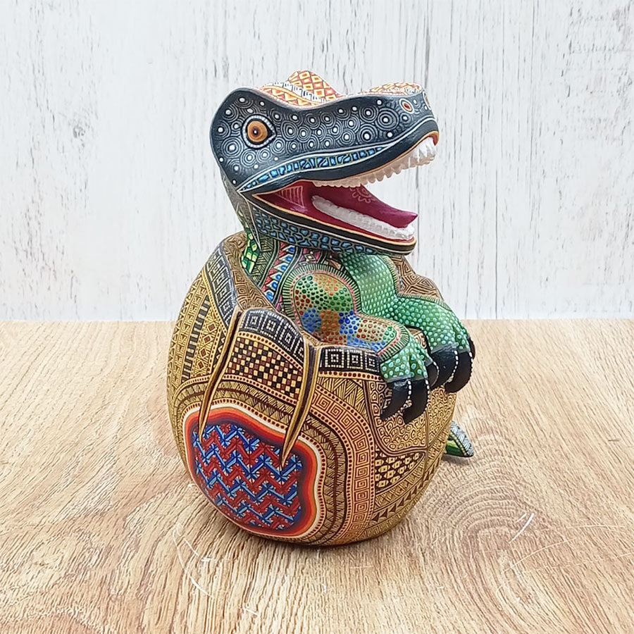 Alebrije-style egg with a dinosaur