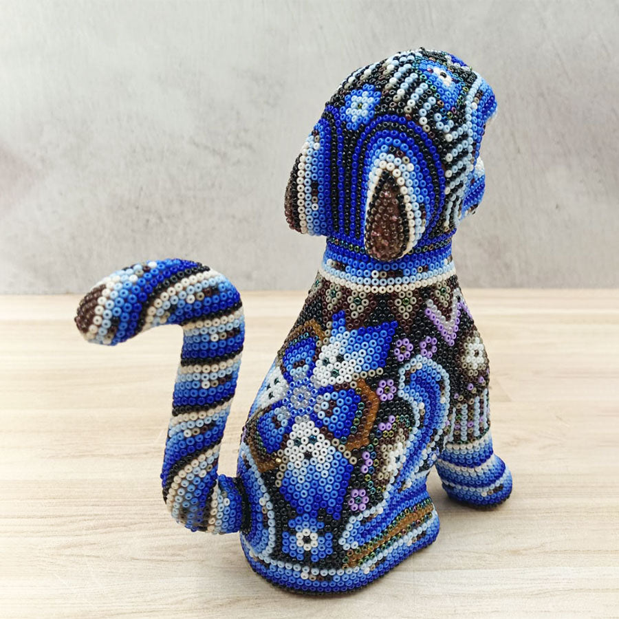Blue jaguar sitting with Huichol Art