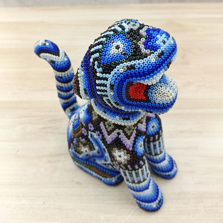 Blue jaguar sitting with Huichol Art