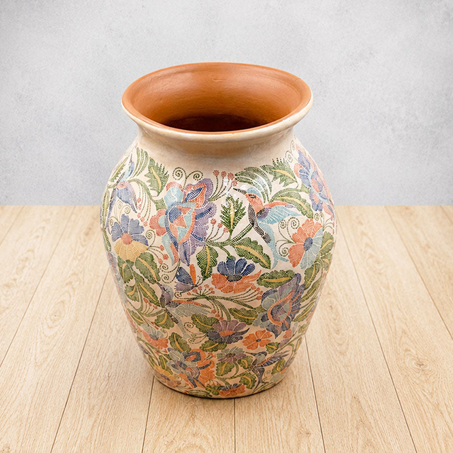 Vase with hummingbirds and flowers
