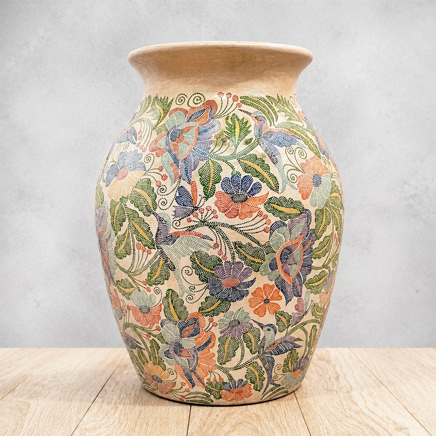 Vase with hummingbirds and flowers