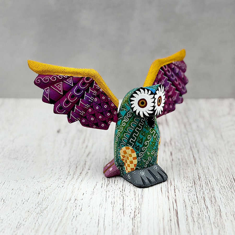 Green alebrije owl with purple wings
