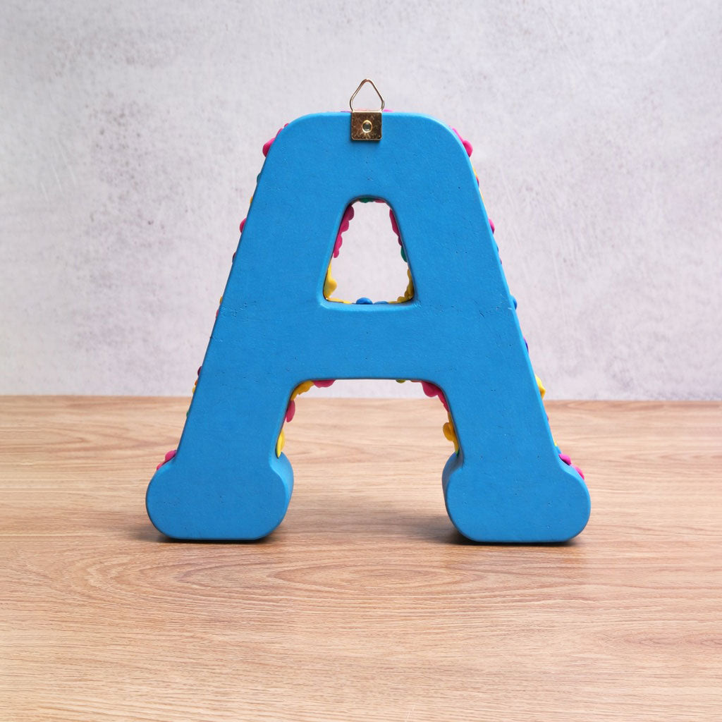Letters of the alphabet with colorful figures, from "A" to "G"