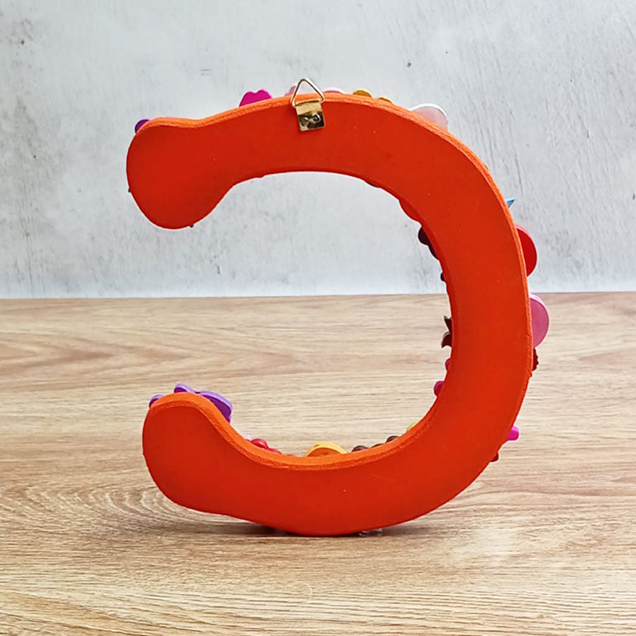 Letras del abecedario con figuritas de colores, de "A" a "G"
