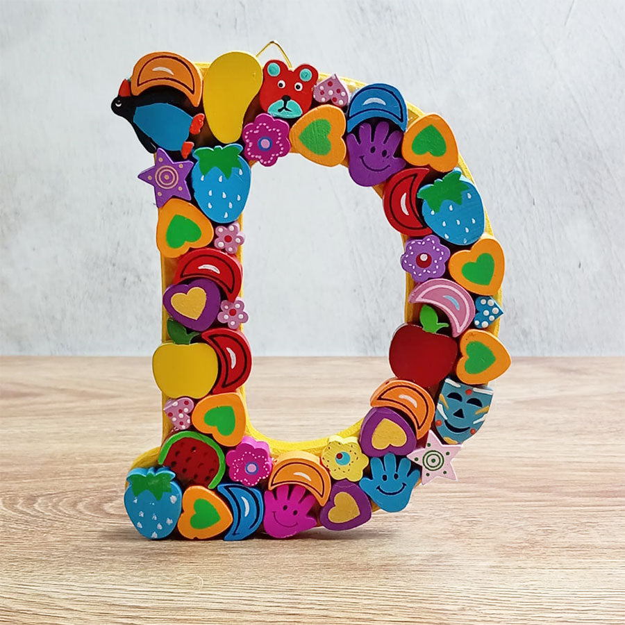 Letras del abecedario con figuritas de colores, de "A" a "G"