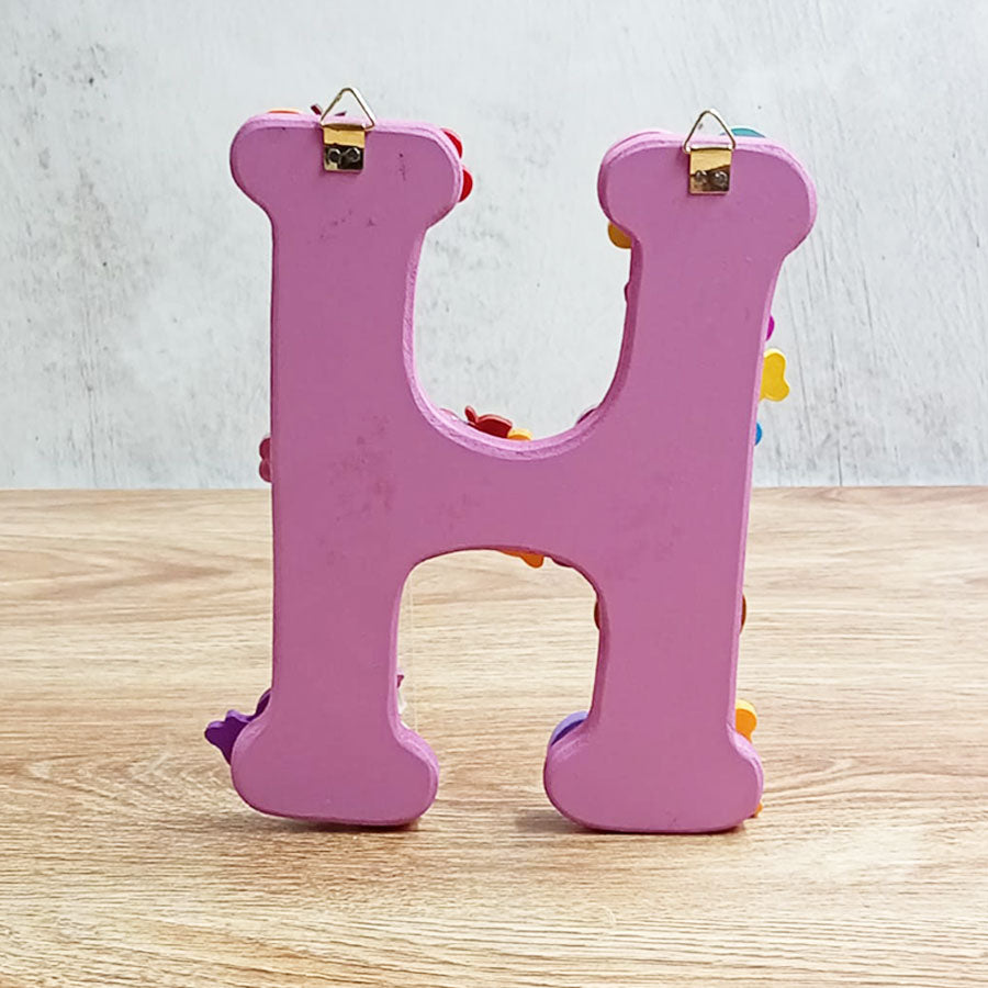 Letters of the alphabet with colorful figures, from "H" to "M"