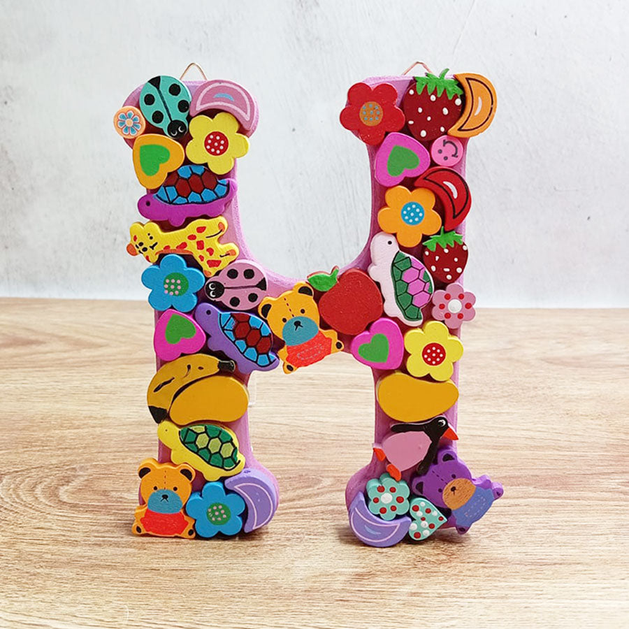 Letters of the alphabet with colorful figures, from "H" to "M"