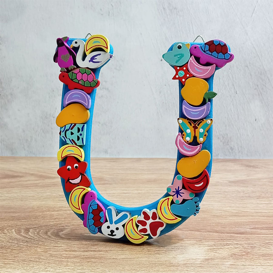 Letters of the alphabet with colorful figures, from  "U" to "Z"