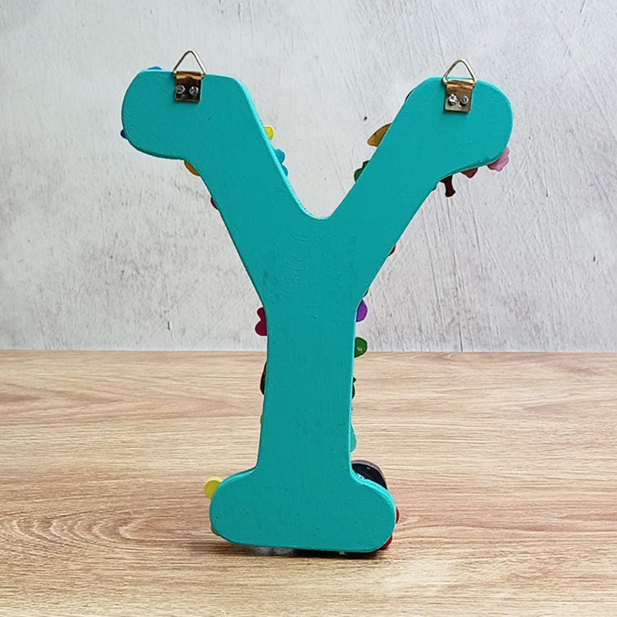 Letras del abecedario con figuritas de colores, de "U" a "Z"