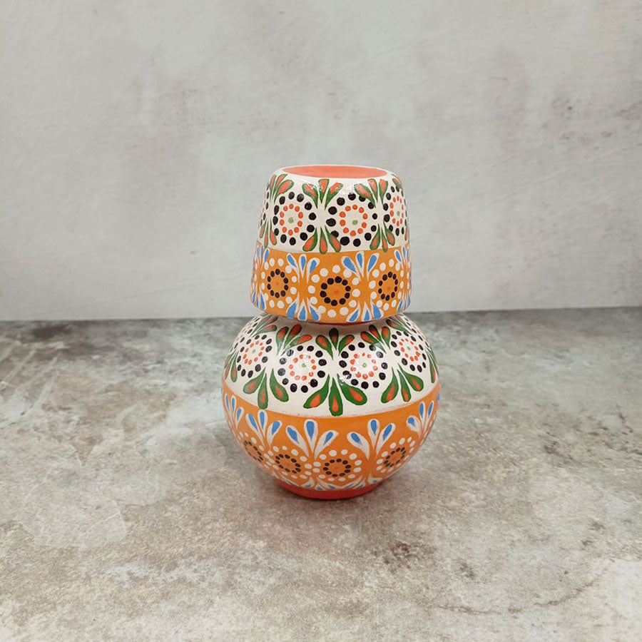 Small decorated decanter and tumbler
