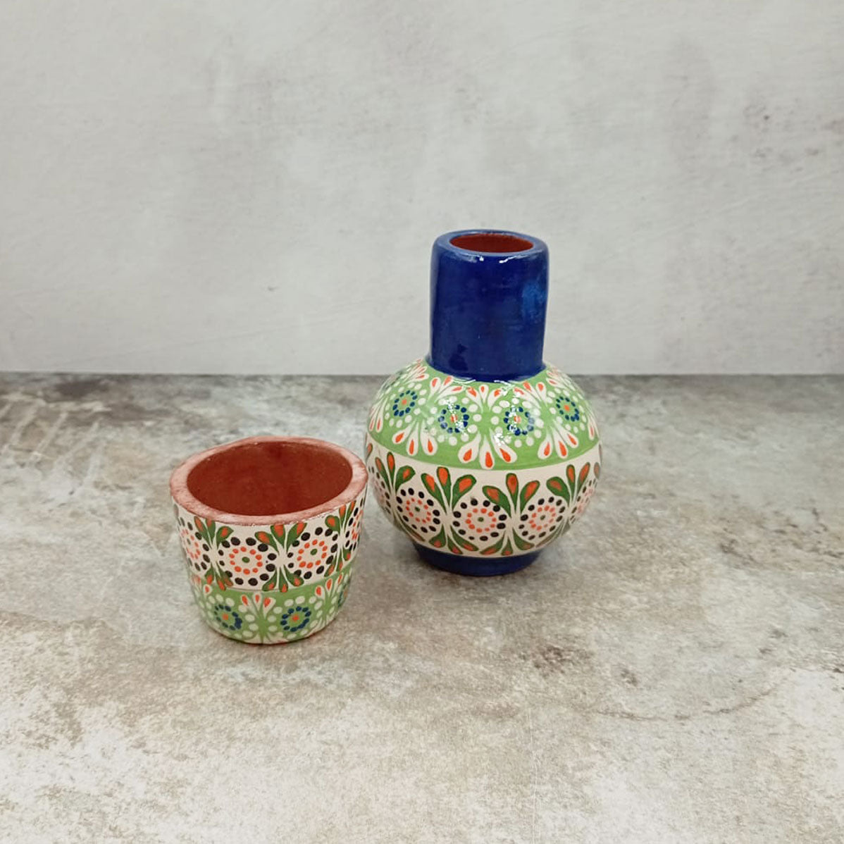 Small decorated decanter and tumbler
